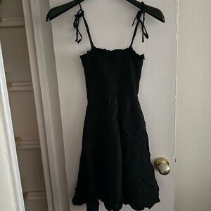 Flirty black  smocked dress with satin skirt. Small. Like new